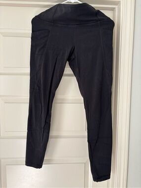 Athleta Black High-Waist Leggings with side pockets. 7/8 length.